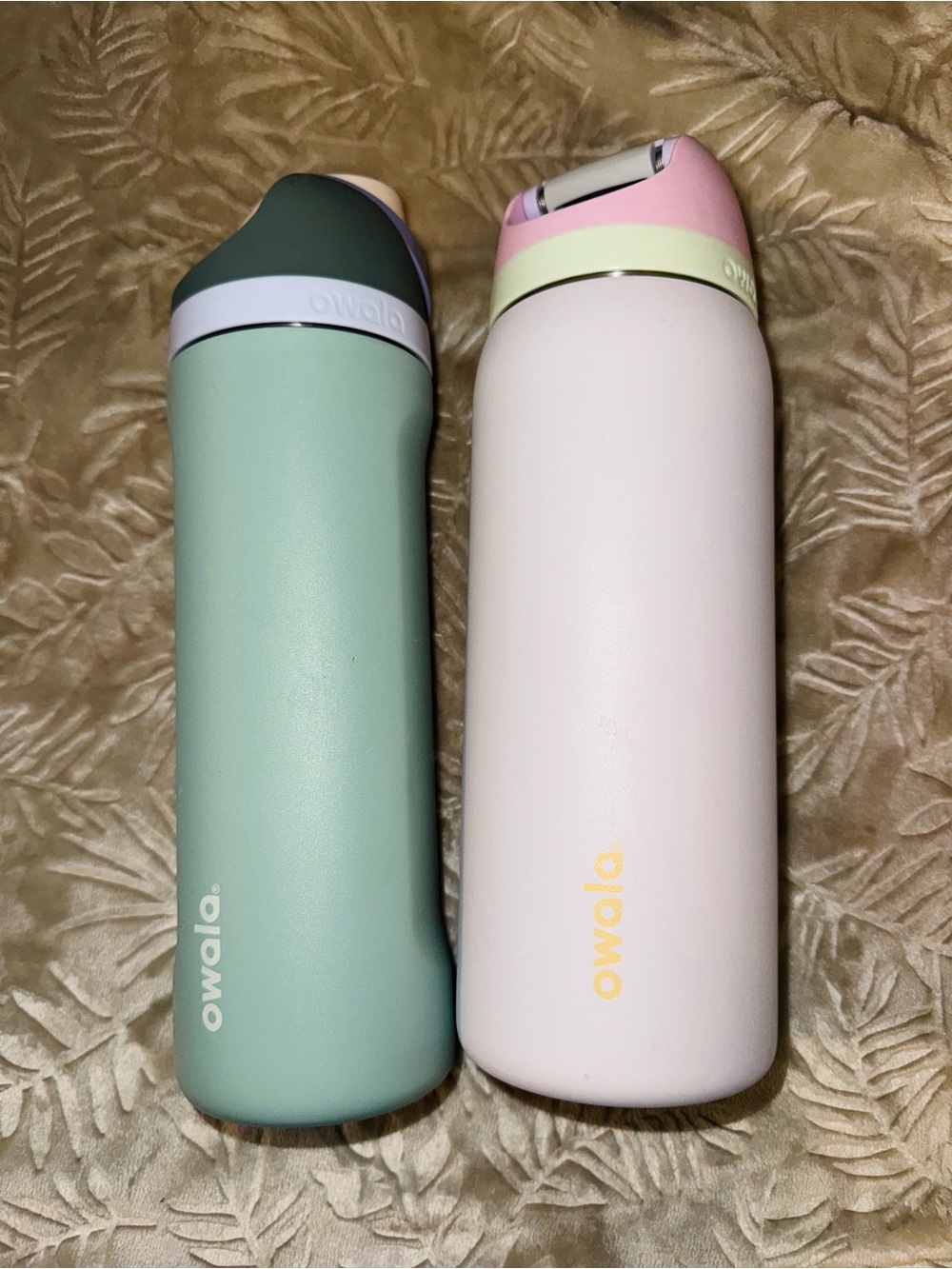 2 Owala Stainless Water Bottles in Mint Green and Pale Pink